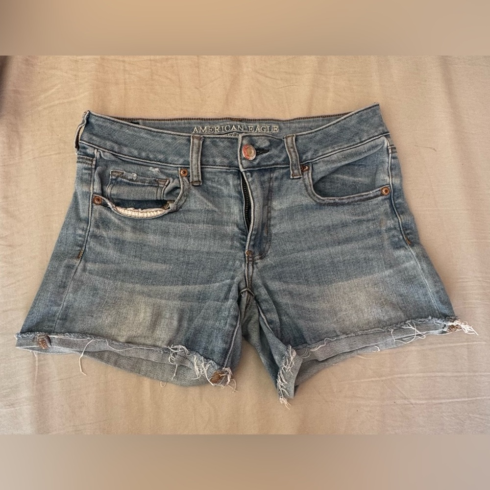 American Eagle Outfitters Light Blue Denim Jeans with Red Button Accent